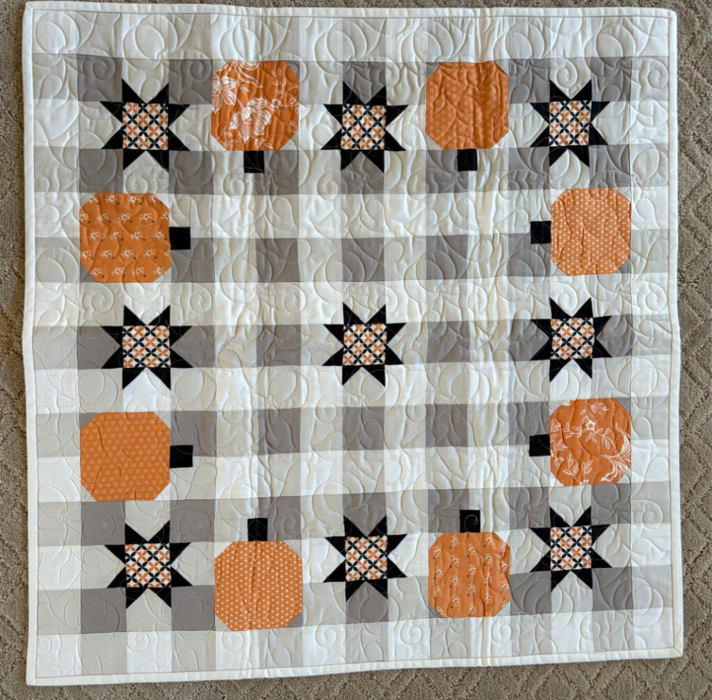 Carried Away Buffalo Check Table Topper with Pumpkins